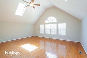 Nashville house for rent - an empty room with a ceiling fan and a window