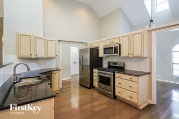 Nashville house for rent - a kitchen with a stove and a refrigerator and a sink