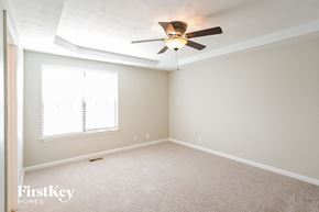 Nashville house for rent - a bedroom with a ceiling fan and a window
