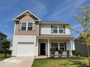 Charlotte house for rent - a white house with a white garage door
