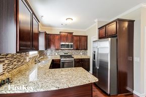 Jefferson house for rent - A kitchen with granite countertops and stainless steel appliances.
