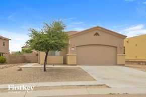 Vail house for rent - a house with a driveway and a tree in front of it