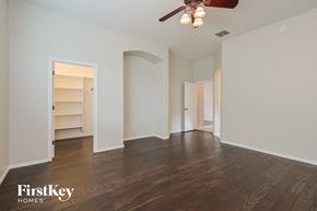 Vail house for rent - an empty living room with a ceiling fan and a closet