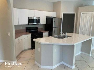 North Port house for rent - a kitchen with a counter top and a sink