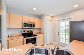 North Port house for rent - A kitchen with a stove, oven, and microwave.