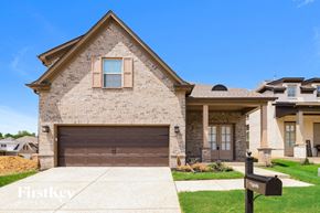 Cordova house for rent - A house with a brown garage door is for sale.