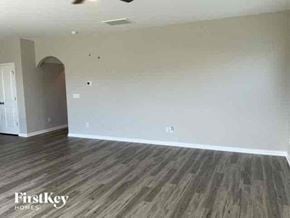 Summerville house for rent - an empty living room with wood floors and white walls