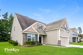 Summerville house for rent - a house with a lawn and a garage