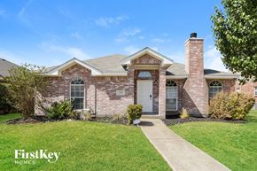 Mesquite house for rent - a brick house with a white door and a lawn