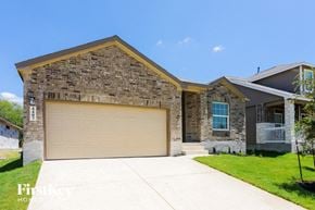 San Antonio house for rent - a garage door in front of a house