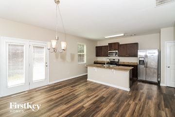 Dallas house for rent - a kitchen with a stainless steel refrigerator and a counter top