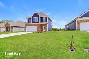 Jemison house for rent - a large lawn in front of a house