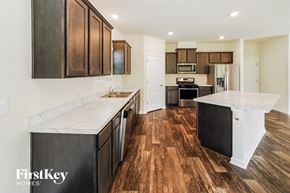 St Augustine house for rent - A kitchen with wooden floors and a white counter top.