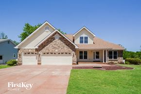 Lake St. Louis house for rent - A house with a garage and a driveway in front of it.