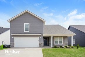 Clarksville house for rent - a gray house with a white garage door