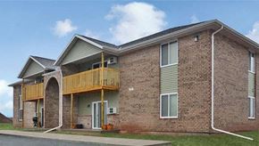 De Pere apartment for rent - a brick building with a balcony on the side