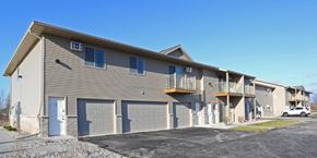 Sheboygan Falls apartment for rent - the front of an apartment building with garage doors