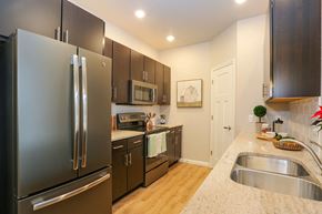 Sheboygan Falls apartment for rent - a kitchen with stainless steel appliances and granite counter tops