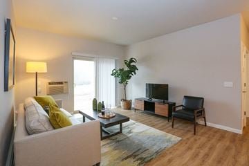 Sheboygan Falls apartment for rent - a living room with a couch and a tv