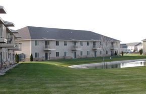 Hobart apartment for rent - a large building with a pond in front of it
