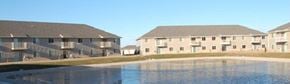 Hobart apartment for rent - two houses are next to a pool of water