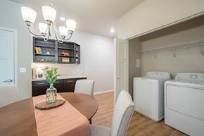 Sturgeon Bay apartment for rent - a kitchen and dining room with a washer and dryer and a dining table