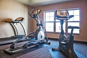 Oshkosh apartment for rent - two exercise machines in an empty gym room