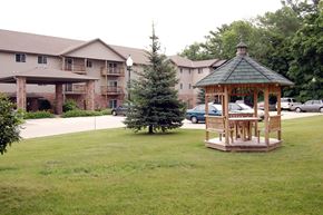 Sturgeon Bay apartment for rent - a gazebo in the middle of a yard with a building in the