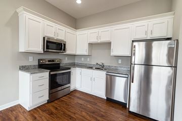 Martinsburg apartment for rent - a kitchen with stainless steel appliances and white cabinets