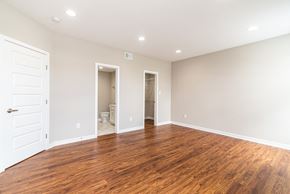 Martinsburg apartment for rent - a living room with a hard wood floor and a white door