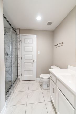 Martinsburg apartment for rent - a white bathroom with a shower toilet and sink