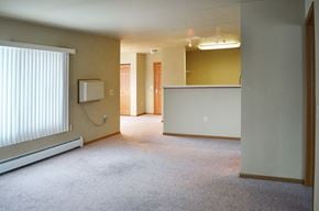 West Bend apartment for rent - A room with a window and a carpeted floor.