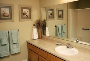 West Bend apartment for rent - A bathroom with a sink, mirror, and towels.
