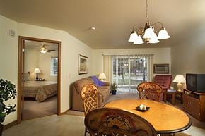 Marshfield apartment for rent - a living room with a dining table and a bedroom with a bed