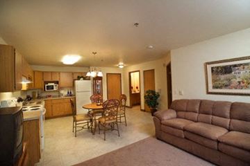 Marshfield apartment for rent - a living room and kitchen with a couch and table