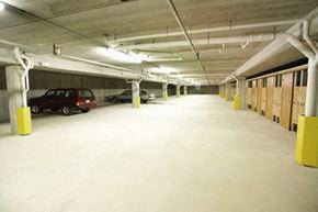 Marshfield apartment for rent - an empty parking garage with cars parked in it