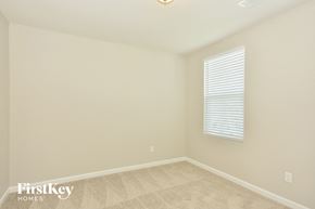 La Vergne house for rent - the upstairs bedroom has a large window and beige carpeting