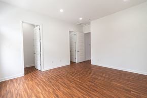 Martinsburg apartment for rent - a living room with a hard wood floor and white walls