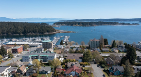 Nanaimo apartment for rent - A small town with a large body of water in the background.