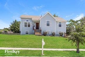 Kansas City house for rent - A house with a white picket fence in front of it.