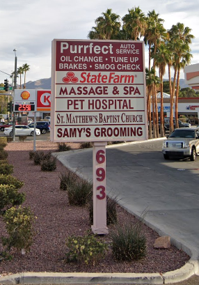 Henderson apartment for rent - a sign on the side of a street in a parking lot