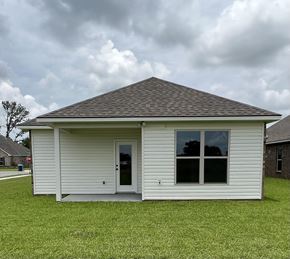 Lafayette house for rent - a small white house in a grassy yard