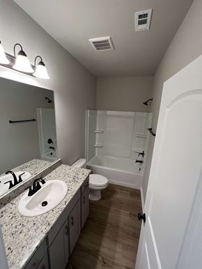 Lafayette house for rent - a bathroom with a sink and a toilet and a shower