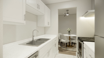 Nanaimo apartment for rent - A kitchen with white cabinets and a black countertop.