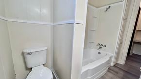 Bay City house for rent - a small bathroom with a toilet and a tub