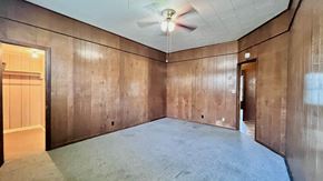 Bay City house for rent - an empty room with a ceiling fan in it