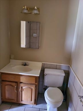 Bay City house for rent - A white toilet sits next to a sink in a bathroom.