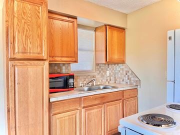 Bay City house for rent - a kitchen with a sink and a stove