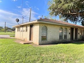 Bay City house for rent - an old brick building with a satellite dish on top of it