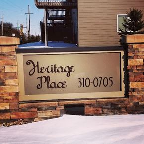 Brandon apartment for rent - A sign that says Heritage Place with a phone number on it.